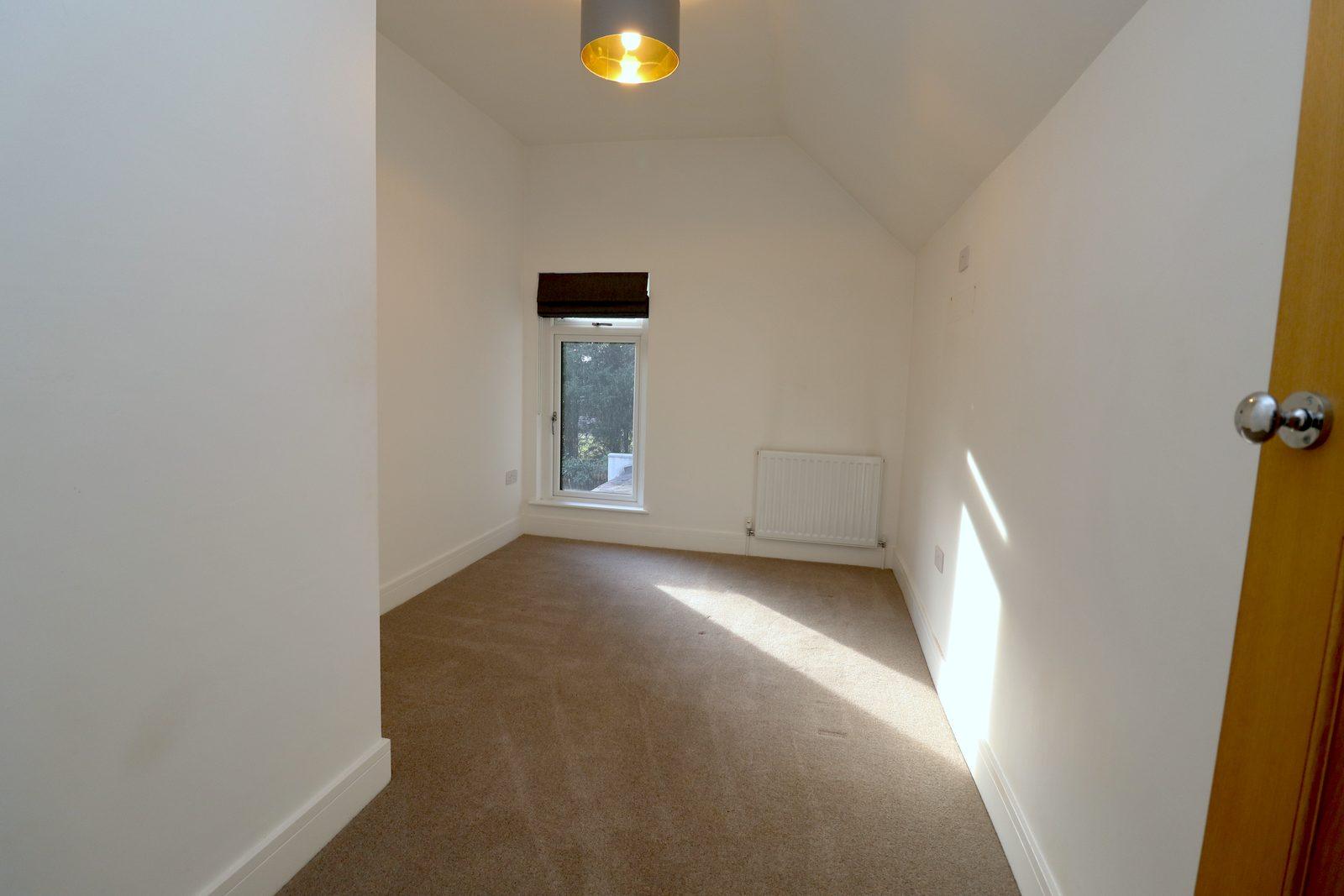 Second bedroom before: empty room with a single window