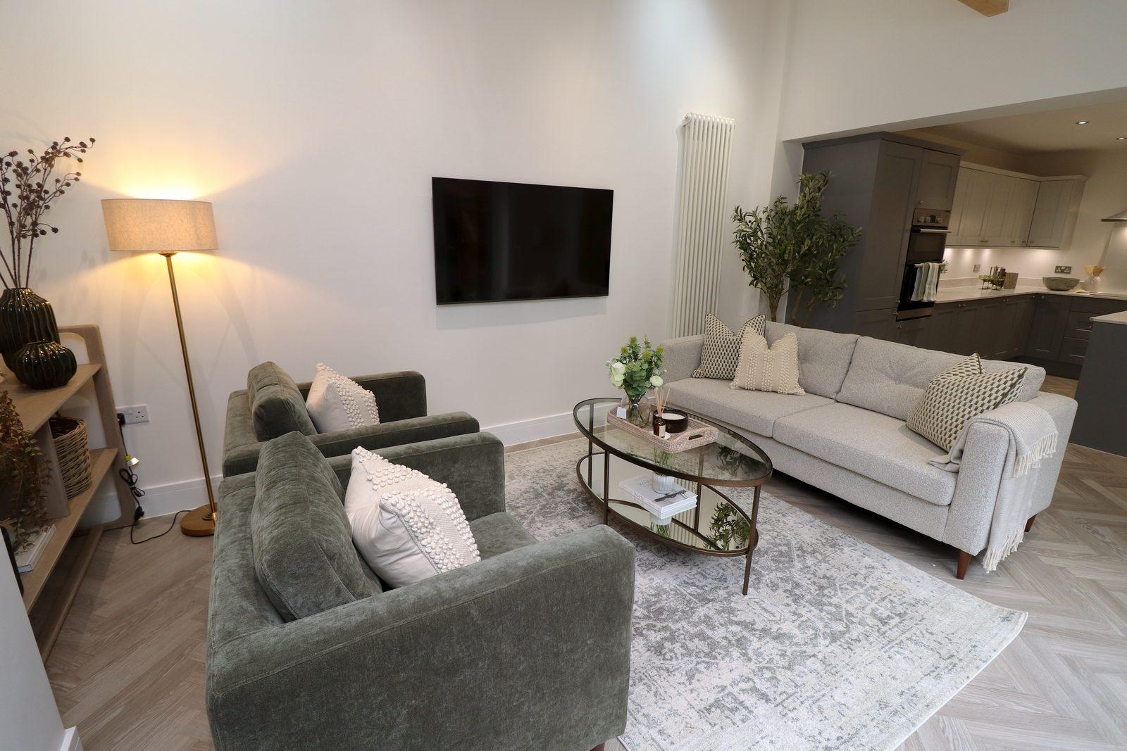 Family room from the window end, armchairs and sofa