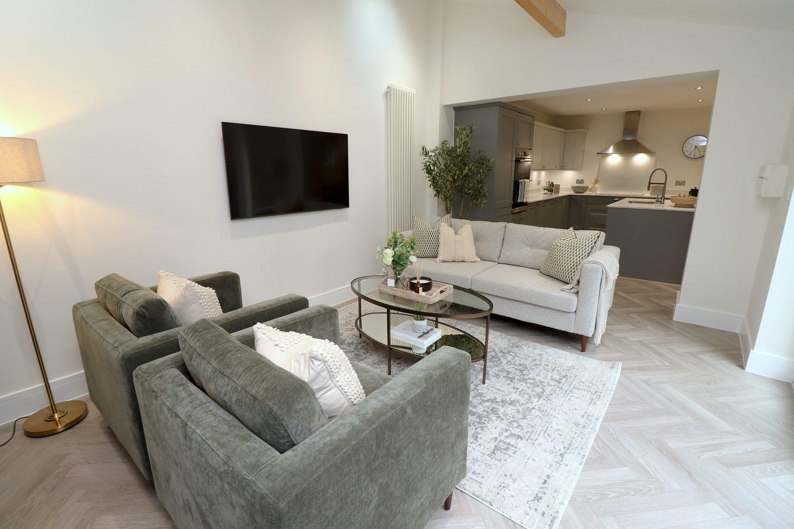 Olive armchairs and round coffee table