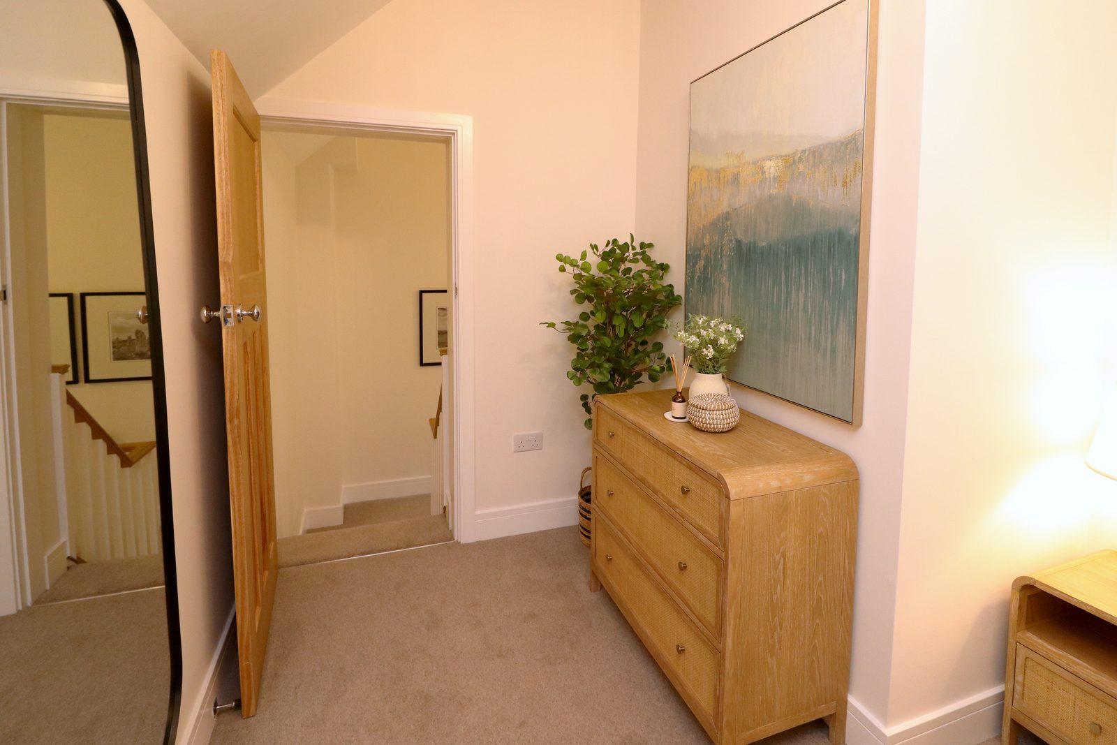 Tall mirror, oak chest and canvas from the door