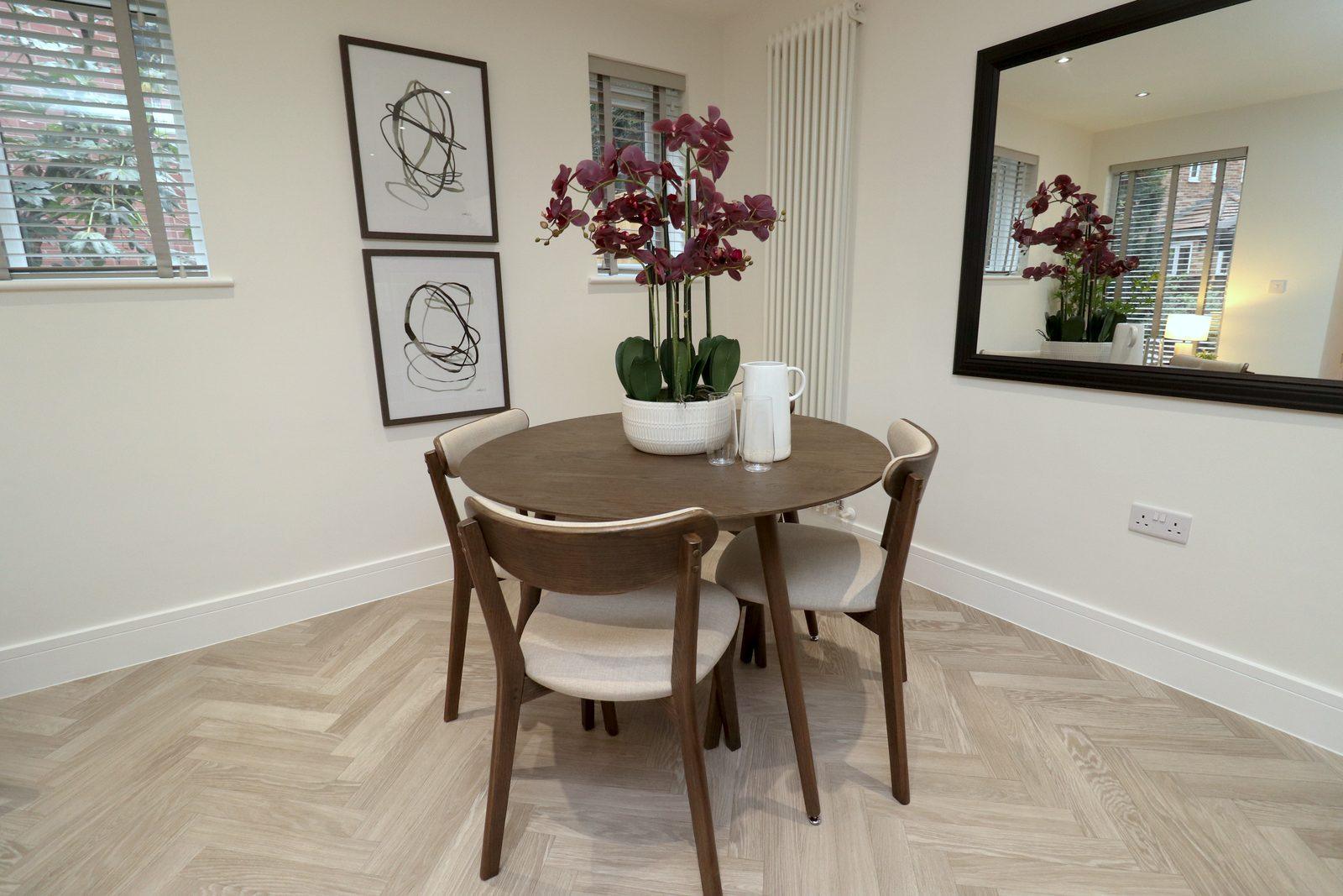 Round dining table, orchid and line drawings